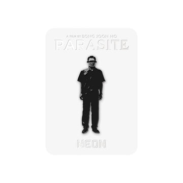 An enamel pin with an illustration of a character from the film Parasite, marked with the name 'MR. KIM'.